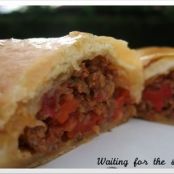 Beef turnovers with peppers and tomatoes