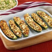 Baked stuffed courgettes with spinach, ricotta and pine nuts