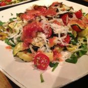 Filled tortellini with roasted courgettes, cherry tomatoes and rocket