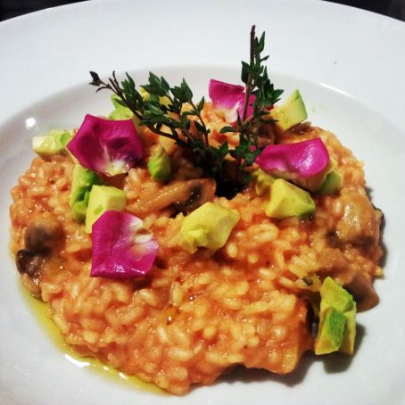 Risotto Milanese with avocado and flower petals