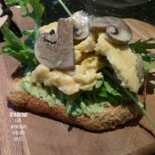 Scrambled eggs with mushrooms, avocado, and rocket