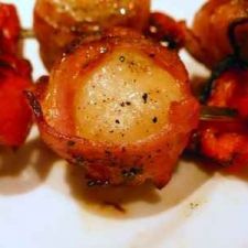 Scallops wrapped in smoked bacon skewers