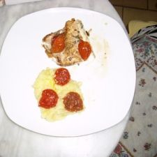 Sea bass with mashed sweet potatoes, confit tomatoes with sweet basil