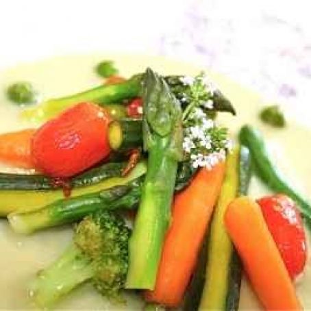 Cream of aubergine soup with crunchy poached spring vegetables