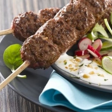 Mint and peanut yogurt sauce for beef skewers with salad