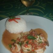 Prawns flambéed with dark rum with rice