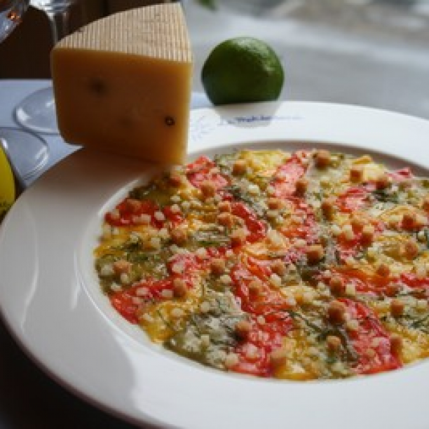 Carpaccio of sweet peppers in white balsamic vinegar, basil and pecorino.