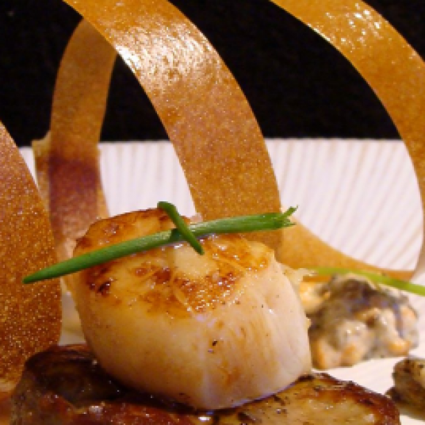 Scallops on a bed of foie gras with ceps