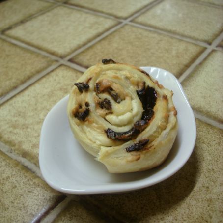 Goat cheese and prune pastry rolls