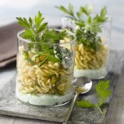 Organic pasta twists with basil and parsley coulis
